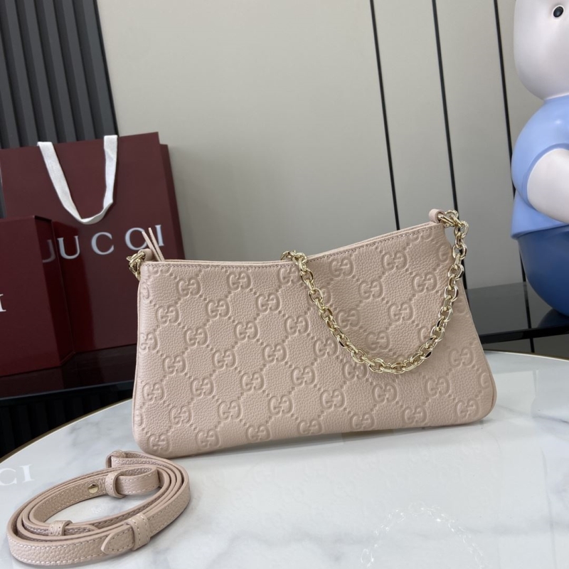 G*u*i clutch bags